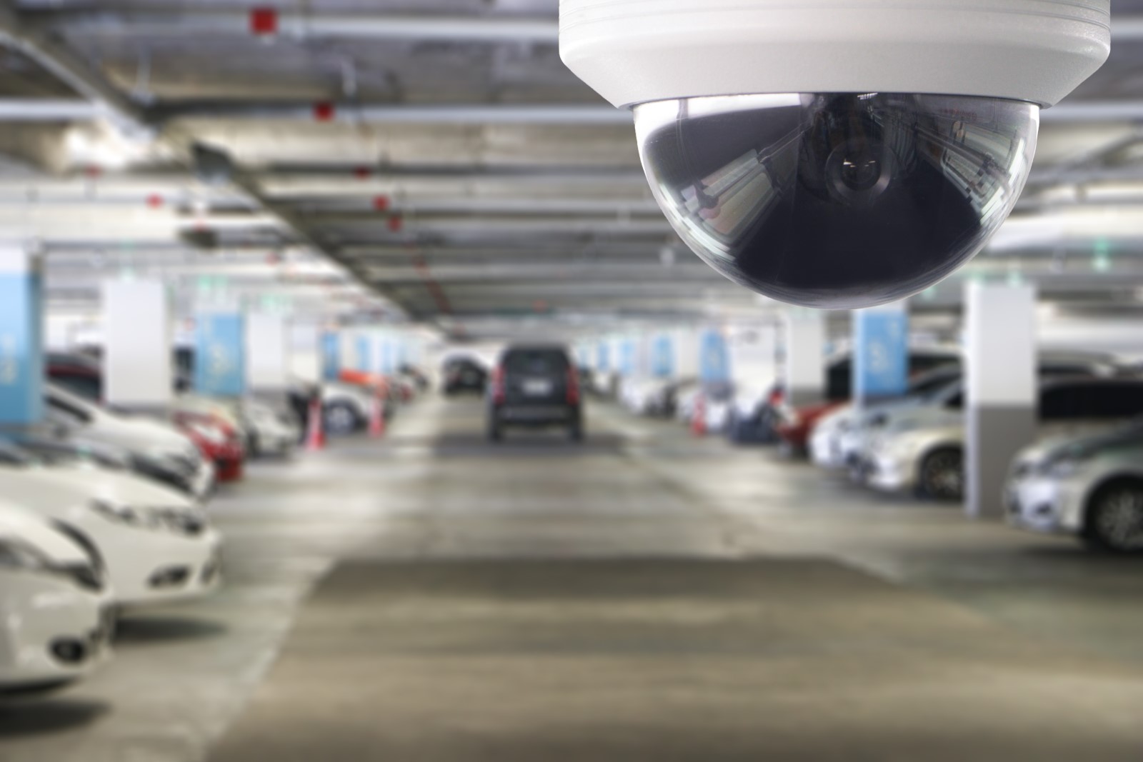 surveillance security camera in a parking garage.